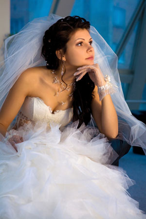 woman sitting in wedding dress